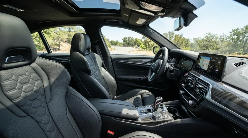 Luxurious front cabin featuring Merino leather sport seats and carbon fiber trim