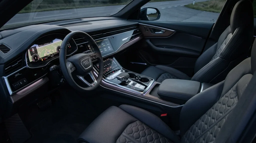 Modern dual touchscreen MMI dashboard layout inside a 2024 Audi Q8 cabin