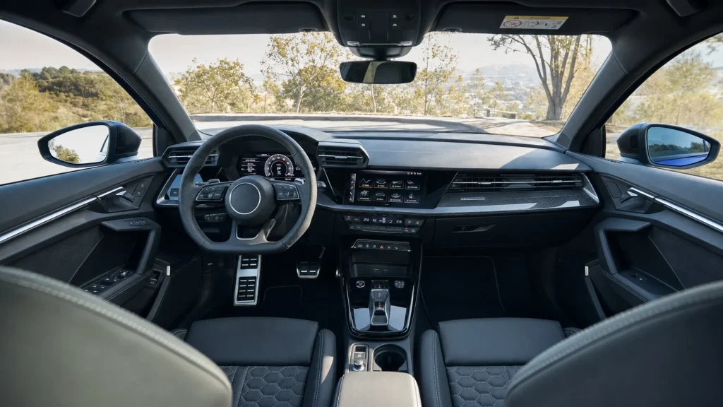 2024 Audi S3 Review: Price, Performance, and Features 5 Interior cabin layout of the 2024 Audi S3 highlighting the carbon-fiber trim on the dashboard and digital gauges