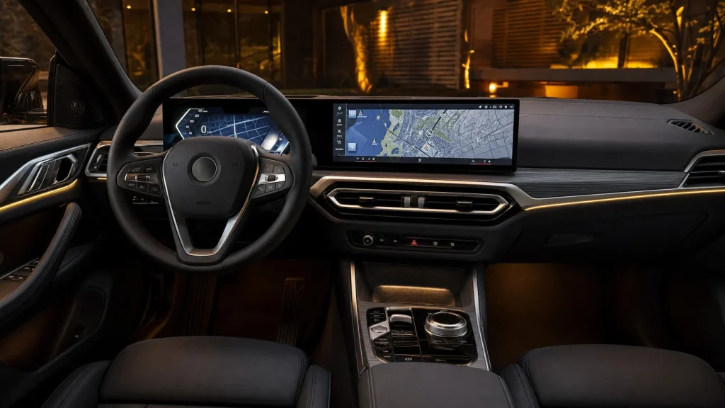 Curved dual displays on the dashboard of a 2024 BMW i4 interior