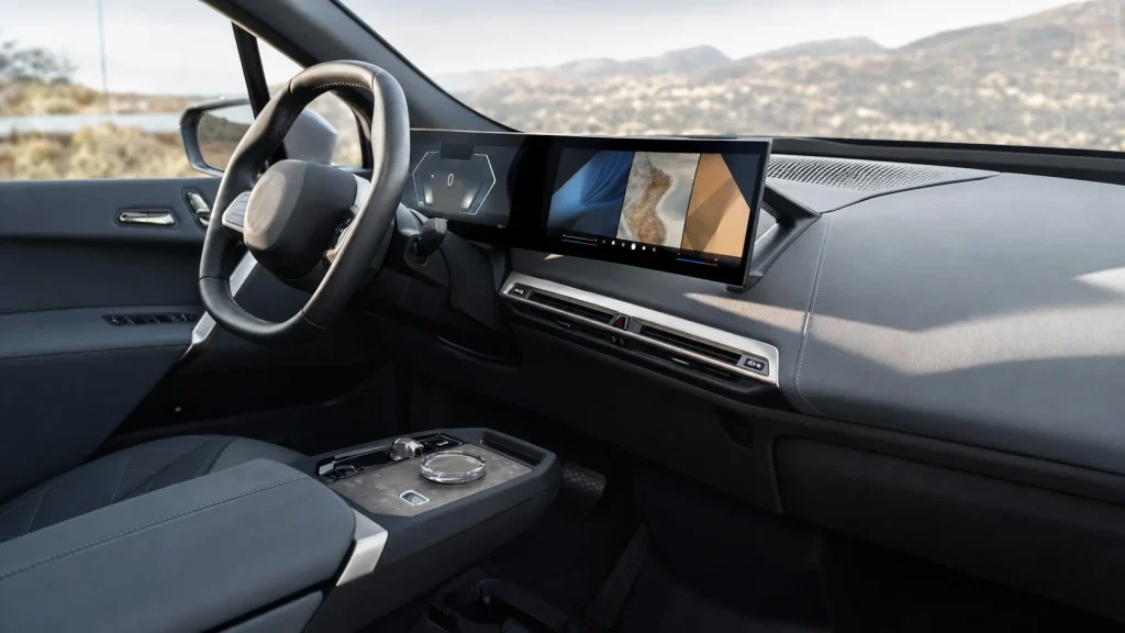 2024 BMW iX Review: Price, Range, and Performance 3 The high-tech curved touchscreen display and clean dashboard of the 2024 BMW iX.