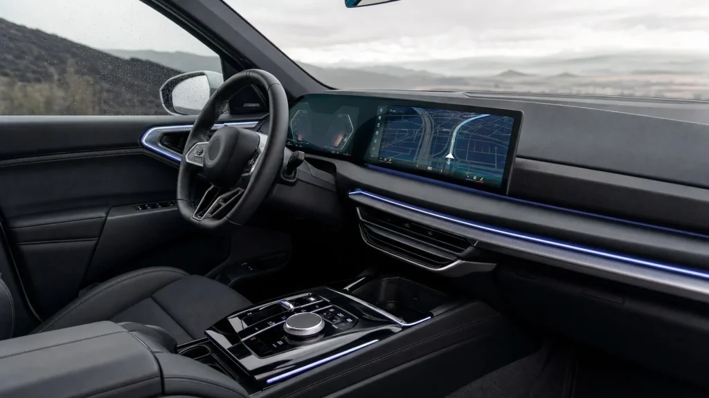 2025 BMW X3 Review: Specs, Price, and Performance 3 2025 BMW X3 interior curved glass display dashboard and iDrive rotary controller