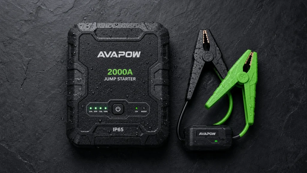 IP65 rated portable car jump starter with green clamps and water droplets