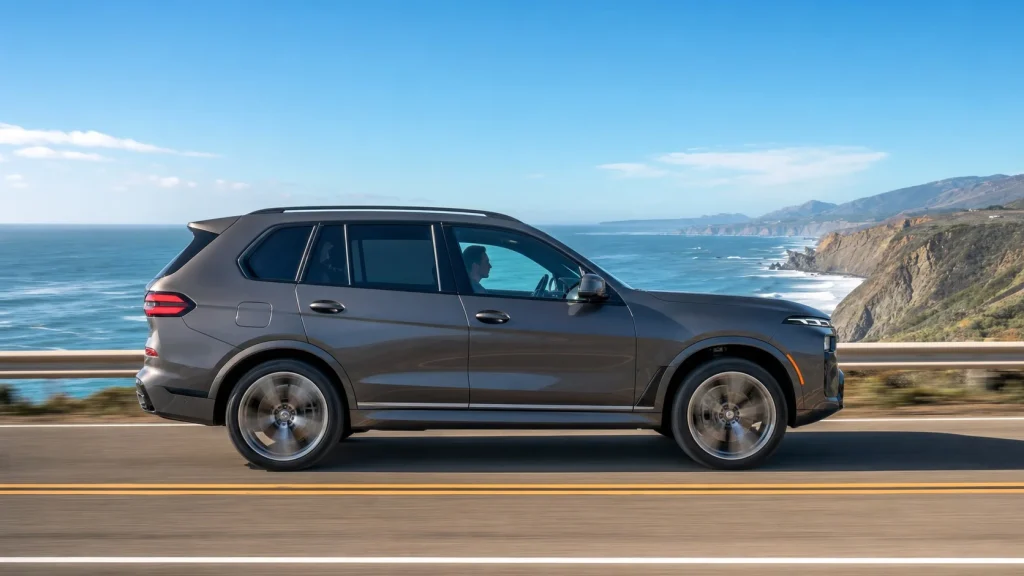 What Mileage Do BMWs Start to Break Down? The Critical Points 3 A modern BMW driving on a scenic highway.